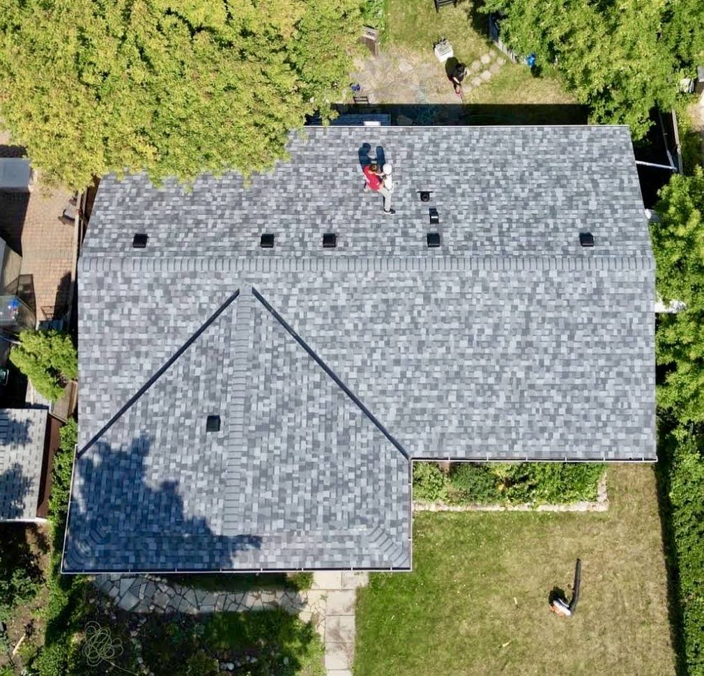 Amiri Roofing crew member working on a Winnipeg residential roof
